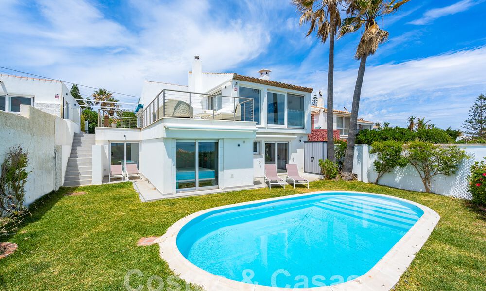 Mediterranean villa for sale with contemporary interior and frontal sea views in gated beachside urbanisation of Estepona 55801