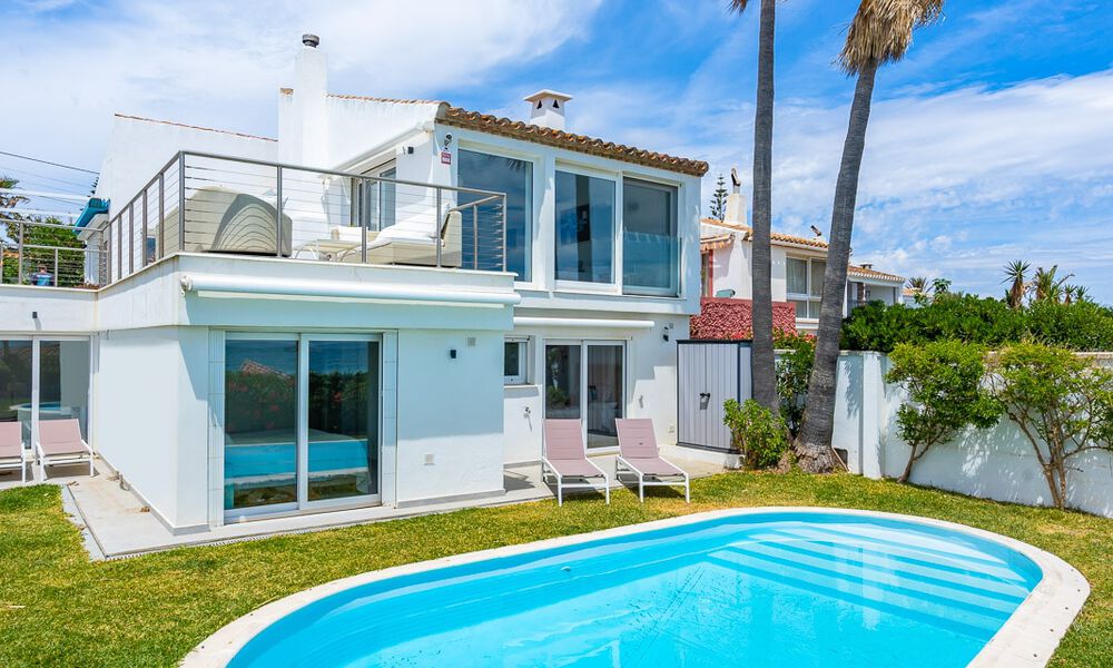 Mediterranean villa for sale with contemporary interior and frontal sea views in gated beachside urbanisation of Estepona 55802