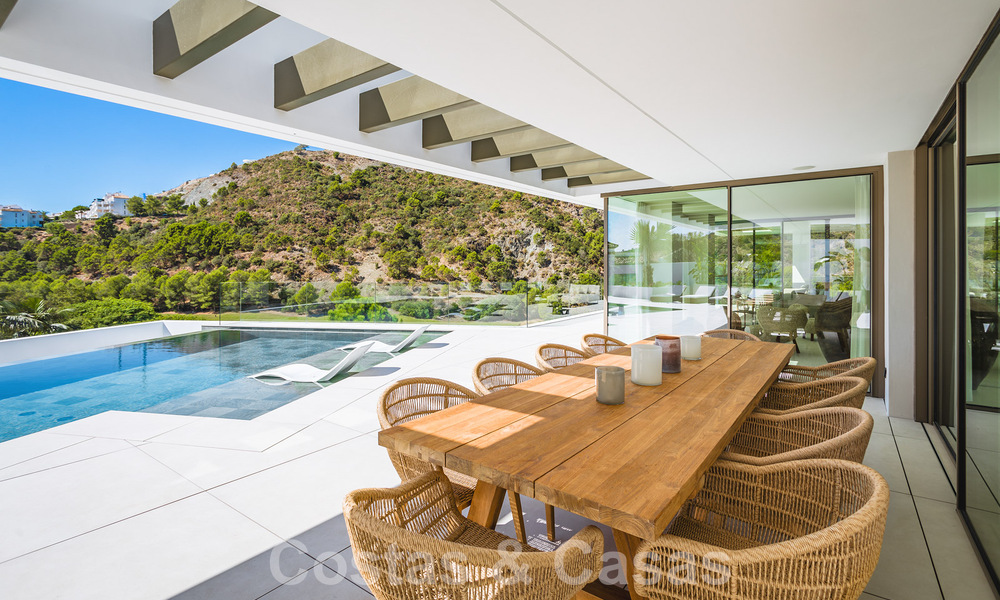 Luxury designer villa for sale in exclusive, gated frontline golf complex with panoramic views in La Quinta, Marbella - Benahavis 59068