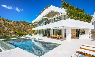 Luxury designer villa for sale in exclusive, gated frontline golf complex with panoramic views in La Quinta, Marbella - Benahavis 59070 