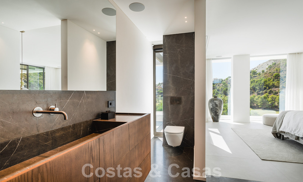 Luxury designer villa for sale in exclusive, gated frontline golf complex with panoramic views in La Quinta, Marbella - Benahavis 59084