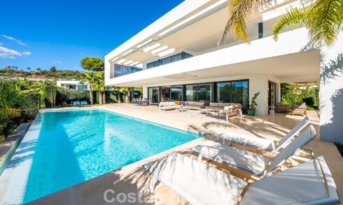 Sophisticated luxury villa with sleek design for sale in gated community in Nueva Andalucia's golf valley in Marbella 60362
