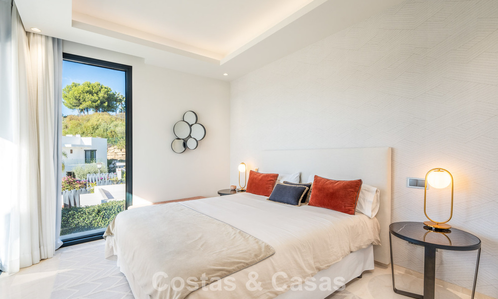Sophisticated luxury villa with sleek design for sale in gated community in Nueva Andalucia's golf valley in Marbella 60364