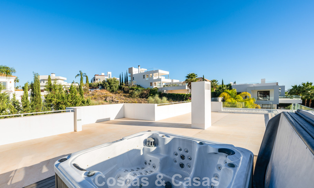 Sophisticated luxury villa with sleek design for sale in gated community in Nueva Andalucia's golf valley in Marbella 60365