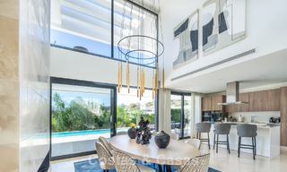 Sophisticated luxury villa with sleek design for sale in gated community in Nueva Andalucia's golf valley in Marbella 60370 