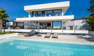 Sophisticated luxury villa with ultra-modern architecture for sale in Nueva Andalucia's golf valley, Marbella 60604 