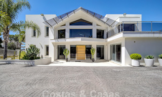Modern luxury villa for sale looking at the golf in Nueva Andalucia, Marbella 60779 