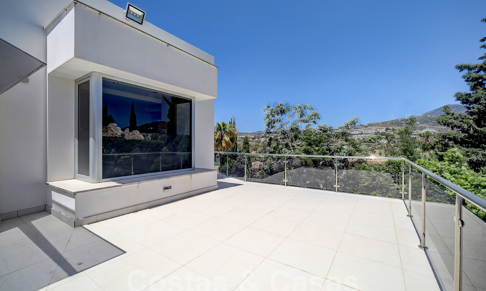 Modern luxury villa for sale looking at the golf in Nueva Andalucia, Marbella 60800