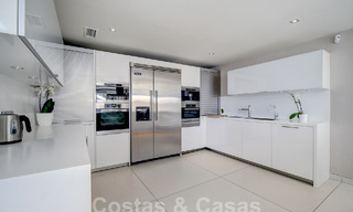 Modern luxury villa for sale looking at the golf in Nueva Andalucia, Marbella 60804 