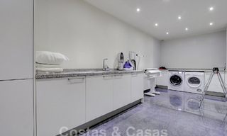 Modern luxury villa for sale looking at the golf in Nueva Andalucia, Marbella 60818 