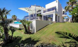 Modern luxury villa for sale looking at the golf in Nueva Andalucia, Marbella 60831 