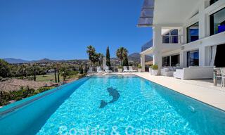 Modern luxury villa for sale looking at the golf in Nueva Andalucia, Marbella 60837 