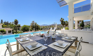 Modern luxury villa for sale looking at the golf in Nueva Andalucia, Marbella 60838 