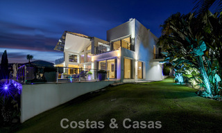 Modern luxury villa for sale looking at the golf in Nueva Andalucia, Marbella 60844 