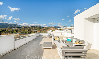 Move-in ready! Modern, luxurious penthouse for sale bordering the golf course, with sea and golf views, East Marbella 62258 