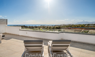 Move-in ready! Modern, luxurious penthouse for sale bordering the golf course, with sea and golf views, East Marbella 62262 