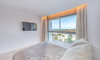 Move-in ready! Modern, luxurious penthouse for sale bordering the golf course, with sea and golf views, East Marbella 62272 