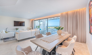 Move-in ready! Modern, luxurious penthouse for sale bordering the golf course, with sea and golf views, East Marbella 62284 