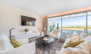 Move-in ready! Modern, luxurious penthouse for sale bordering the golf course, with sea and golf views, East Marbella 62288 