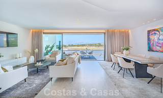 Move-in ready! Modern, luxurious penthouse for sale bordering the golf course, with sea and golf views, East Marbella 62296 