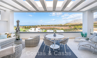Move-in ready! Modern, luxurious penthouse for sale bordering the golf course, with sea and golf views, East Marbella 62299 