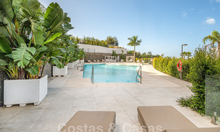 Move-in ready! Modern, luxurious penthouse for sale bordering the golf course, with sea and golf views, East Marbella 62313 