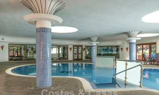 Modern renovated garden apartment for sale in an exclusive frontline beach complex on the New Golden Mile between Marbella and Estepona 62613 
