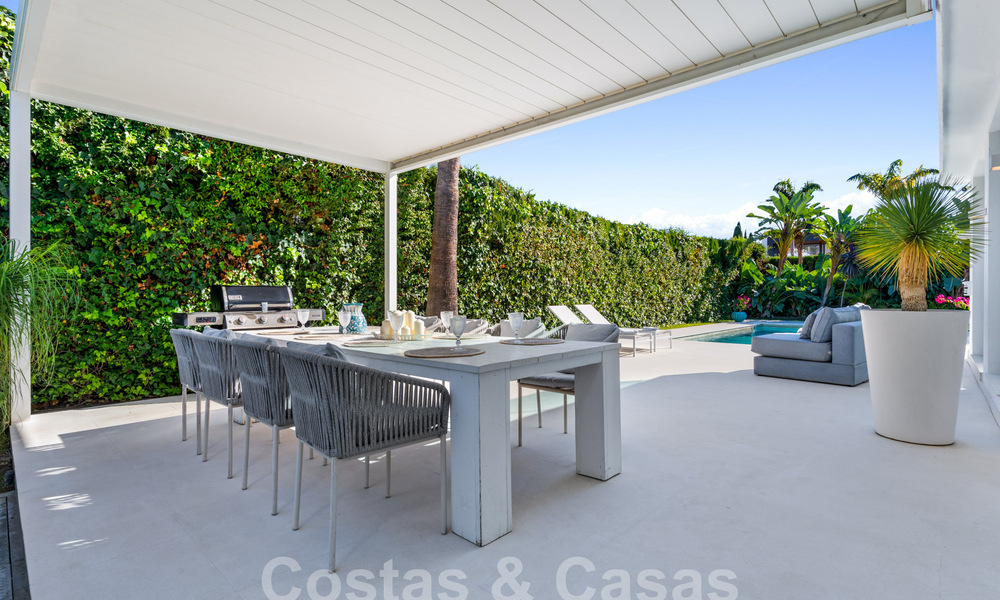 Modern luxury villa for sale with contemporary Mediterranean architecture located in Nueva Andalucia's golf valley, Marbella 63000