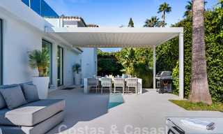 Modern luxury villa for sale with contemporary Mediterranean architecture located in Nueva Andalucia's golf valley, Marbella 63001 
