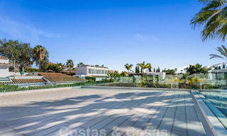 Modern luxury villa for sale with contemporary Mediterranean architecture located in Nueva Andalucia's golf valley, Marbella 63003 