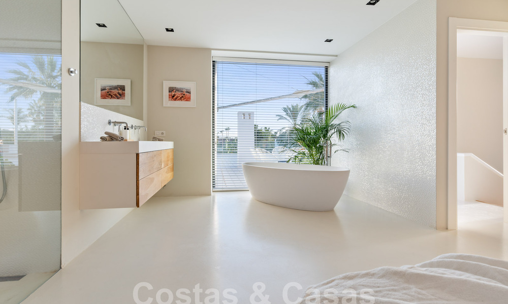 Modern luxury villa for sale with contemporary Mediterranean architecture located in Nueva Andalucia's golf valley, Marbella 63018