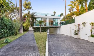Modern luxury villa for sale with contemporary Mediterranean architecture located in Nueva Andalucia's golf valley, Marbella 63022 
