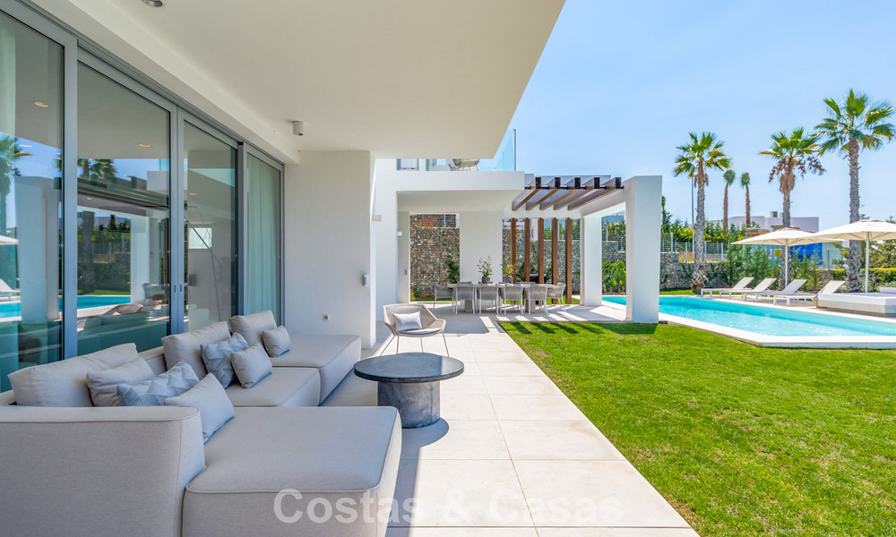 Modernist villa with sleek design and stunning sea views for sale in gated golf community in East Marbella 63574