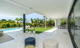 Superior luxury villa with modern architecture for sale a stone's throw from Nueva Andalucia's golf valley, Marbella 64186 