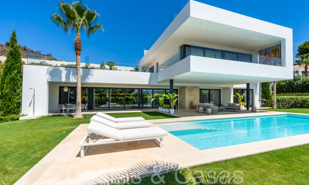 Superior luxury villa with modern architecture for sale a stone's throw from Nueva Andalucia's golf valley, Marbella 64209
