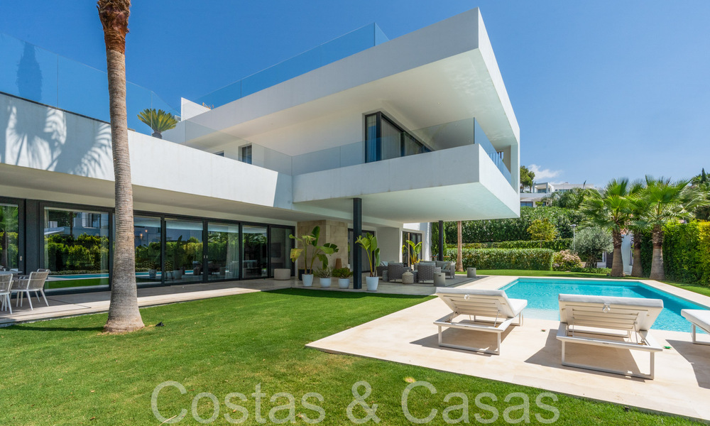 Superior luxury villa with modern architecture for sale a stone's throw from Nueva Andalucia's golf valley, Marbella 64235