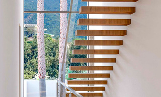 High-end designer villa with panoramic mountain and sea views for sale in a gated resort in Benahavis - Marbella 74911 