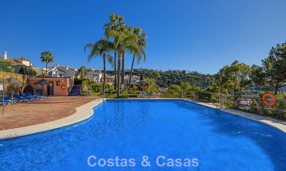 Spacious townhouse with beautiful golf and sea views for sale, in an exclusive golf urbanization in Benahavis - Marbella 775216