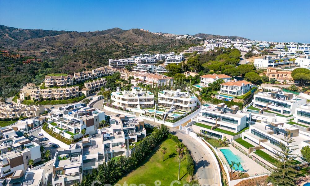 New, large designer apartments with golf and sea views in an avant-garde architectural style for sale in Marbella East 776193