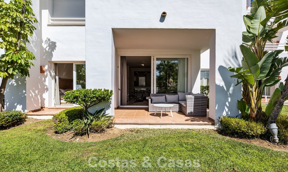 Garden apartment for sale in an exclusive complex near a large blue lagoon on the Costa del Sol 777429