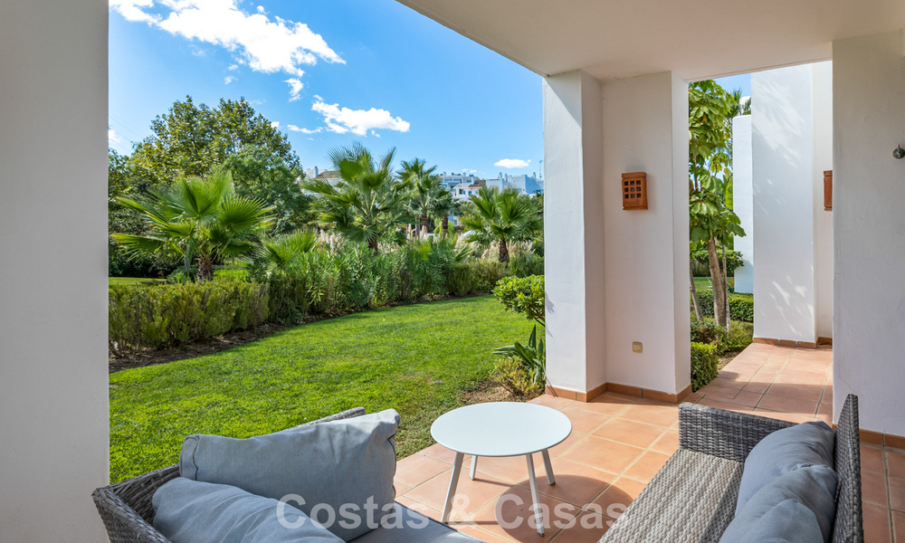Garden apartment for sale in an exclusive complex near a large blue lagoon on the Costa del Sol 777430
