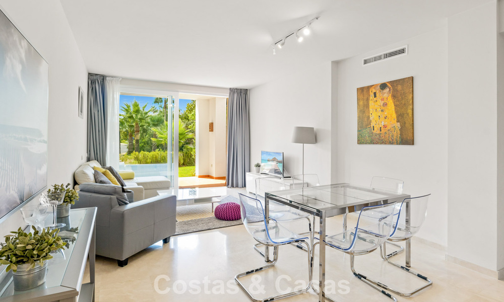 Garden apartment for sale in an exclusive complex near a large blue lagoon on the Costa del Sol 777433