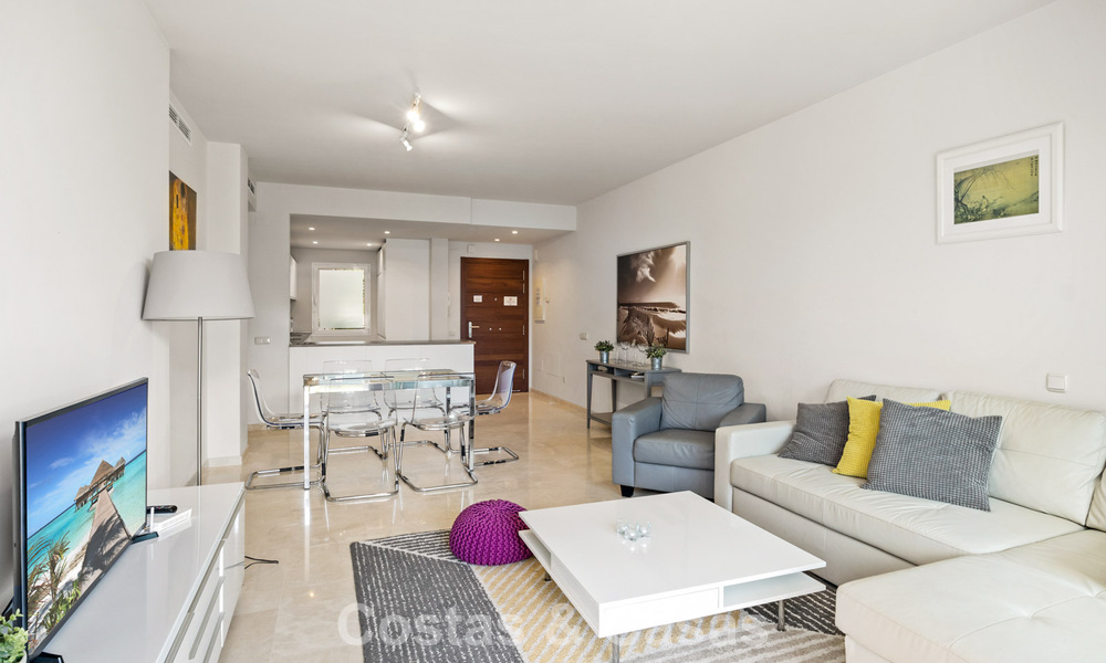 Garden apartment for sale in an exclusive complex near a large blue lagoon on the Costa del Sol 777434