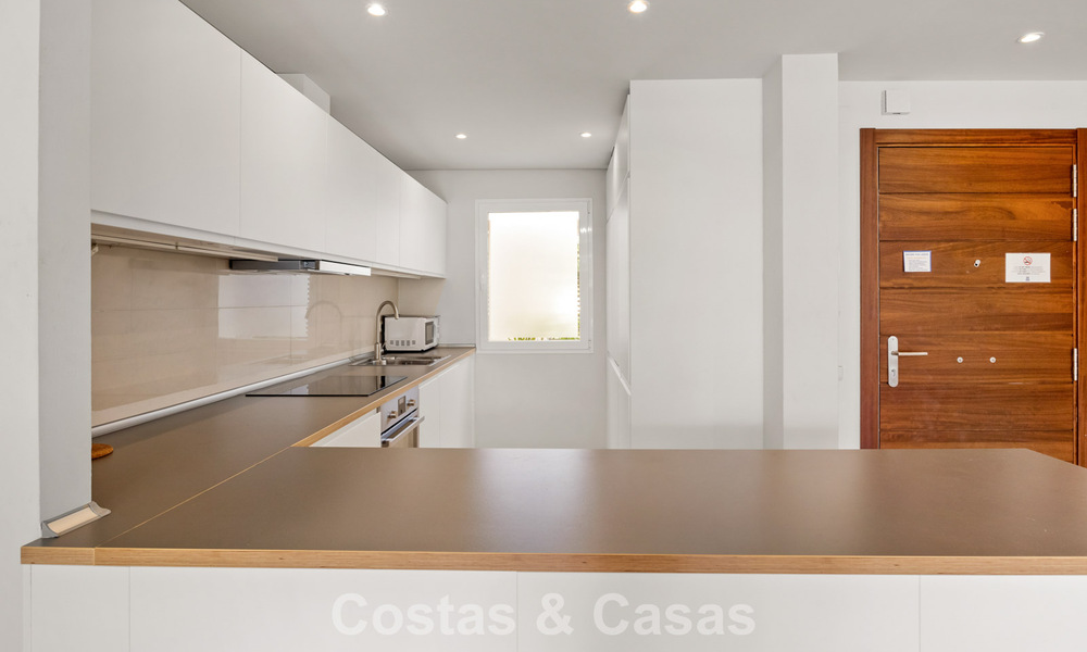 Garden apartment for sale in an exclusive complex near a large blue lagoon on the Costa del Sol 777438