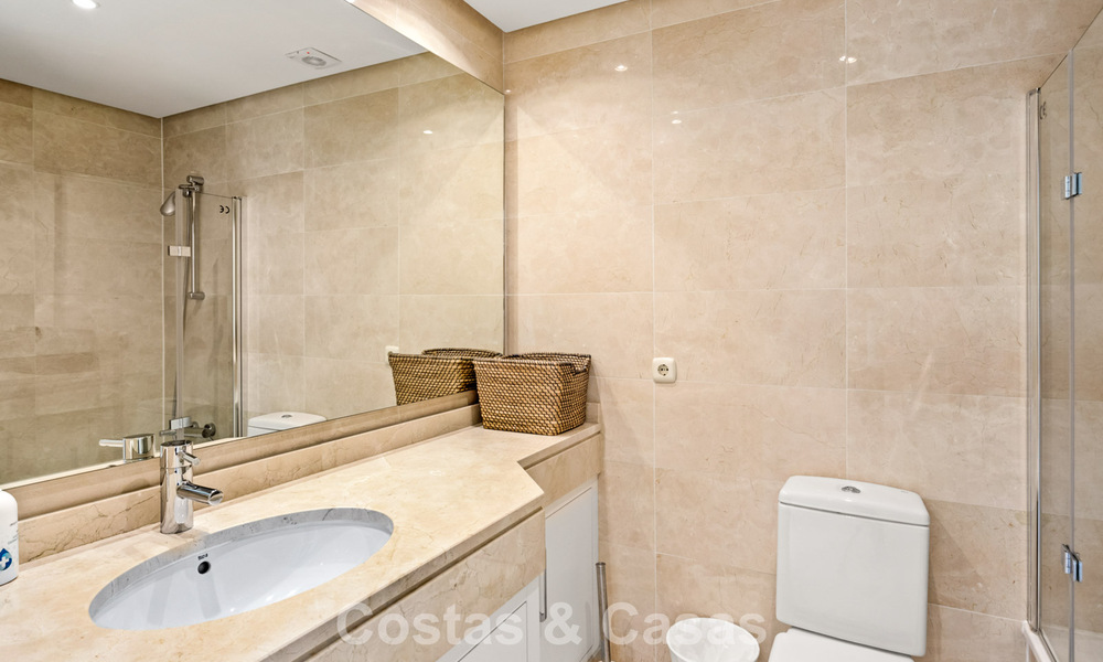 Garden apartment for sale in an exclusive complex near a large blue lagoon on the Costa del Sol 777441