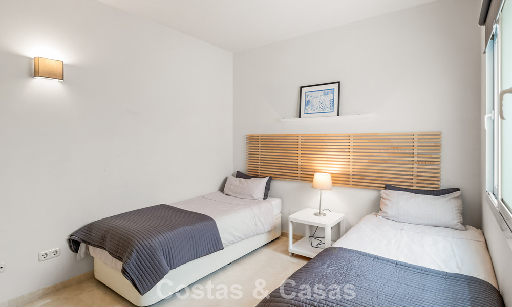 Garden apartment for sale in an exclusive complex near a large blue lagoon on the Costa del Sol 777443