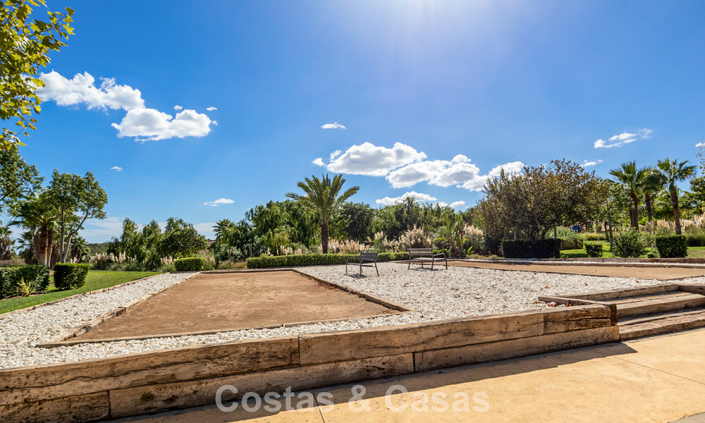 Garden apartment for sale in an exclusive complex near a large blue lagoon on the Costa del Sol 777444