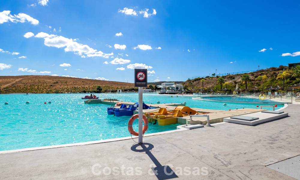 Garden apartment for sale in an exclusive complex near a large blue lagoon on the Costa del Sol 777449
