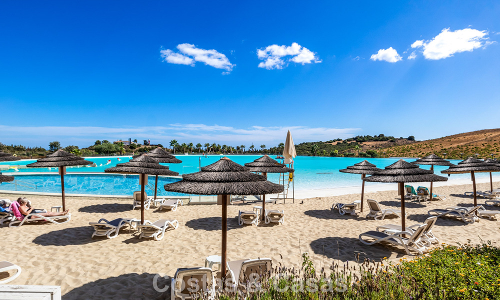 Garden apartment for sale in an exclusive complex near a large blue lagoon on the Costa del Sol 777452