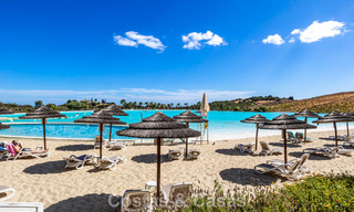 Garden apartment for sale in an exclusive complex near a large blue lagoon on the Costa del Sol 777452 